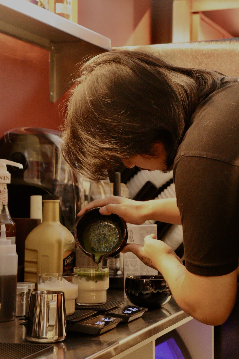 A barista working at the machine